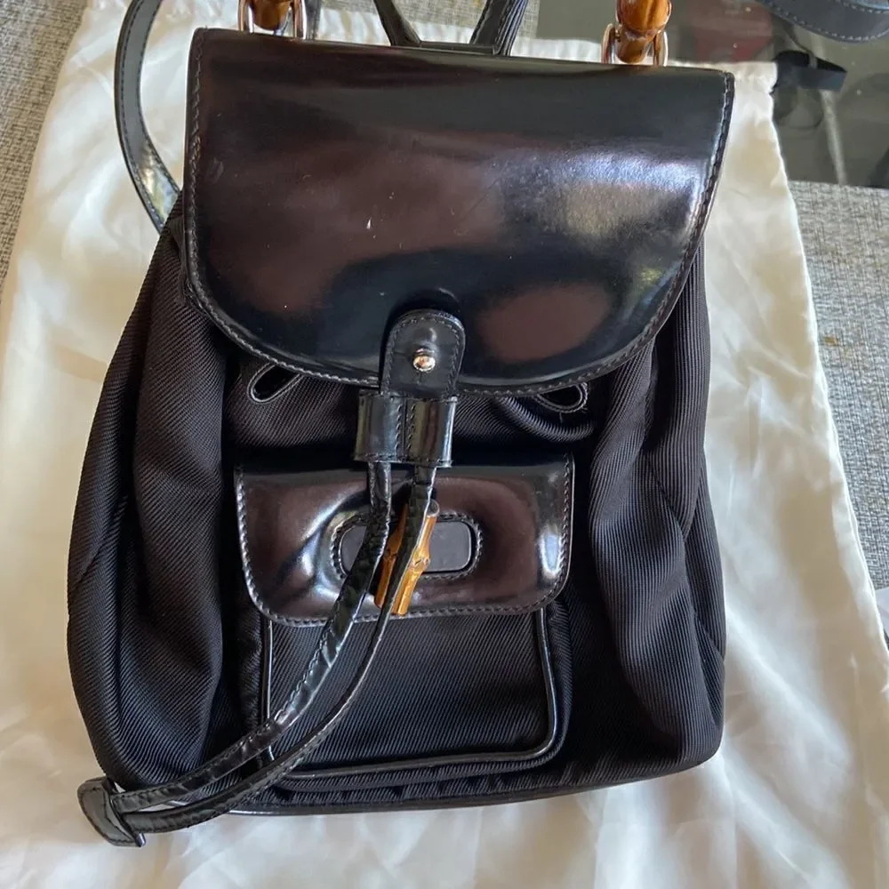 Gucci tassel oval mini backpack bambu Black impressive condition original dustba